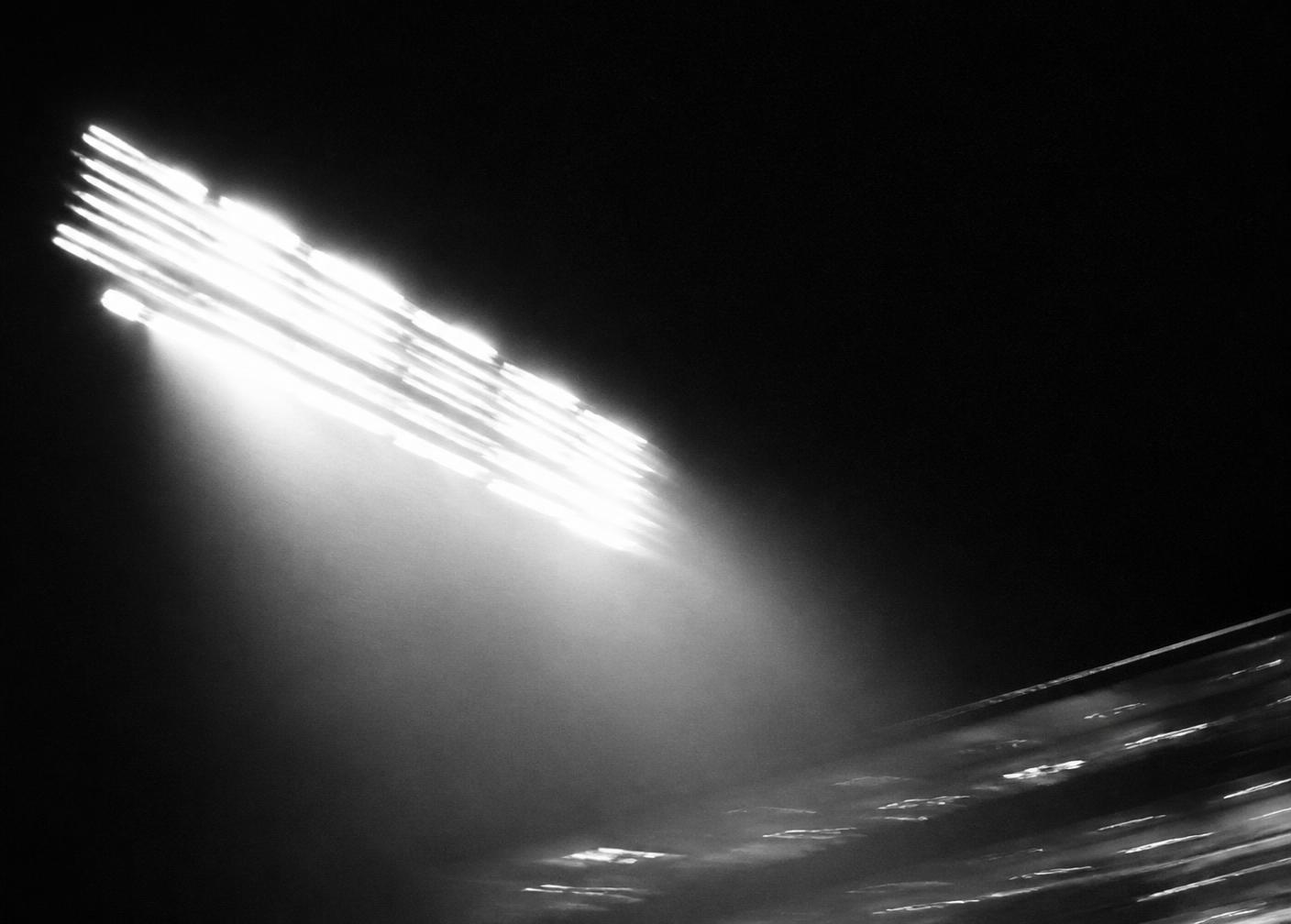 Stadium floodlights at night